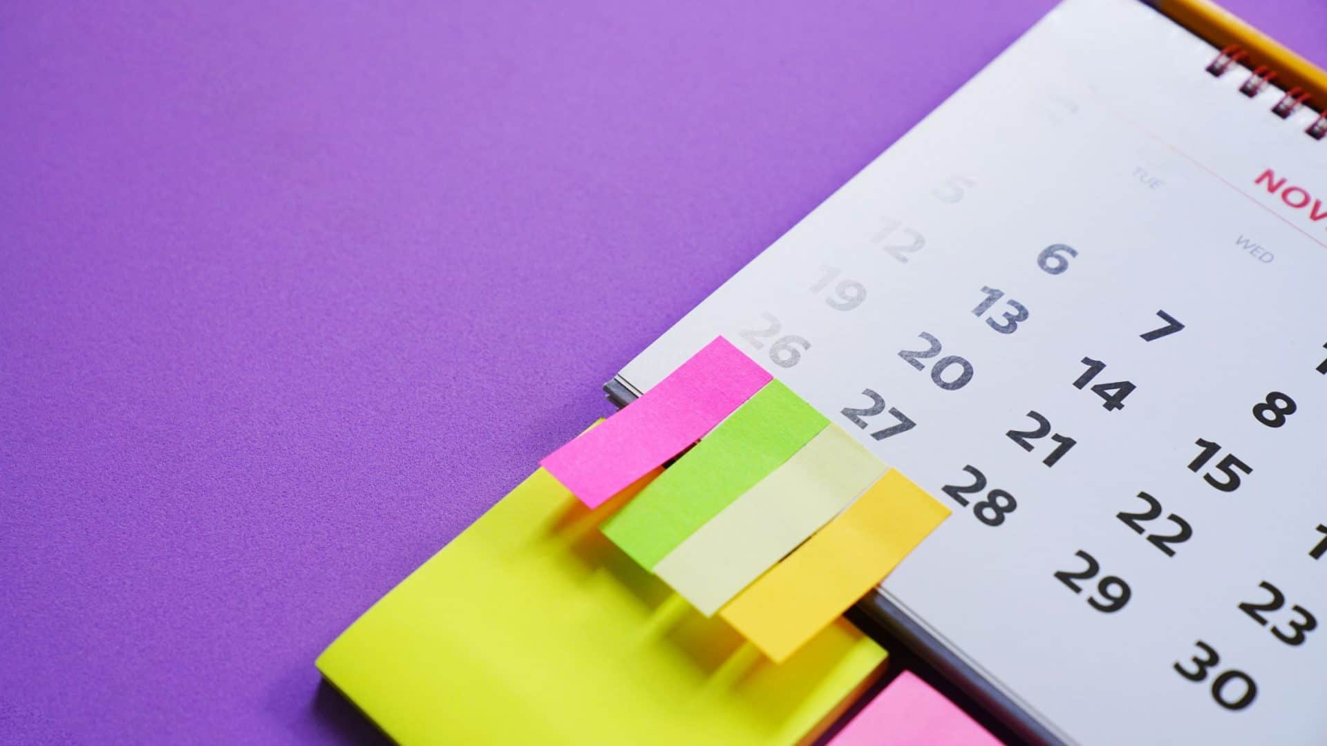 in-person event ideas for small business - calendar on purple background