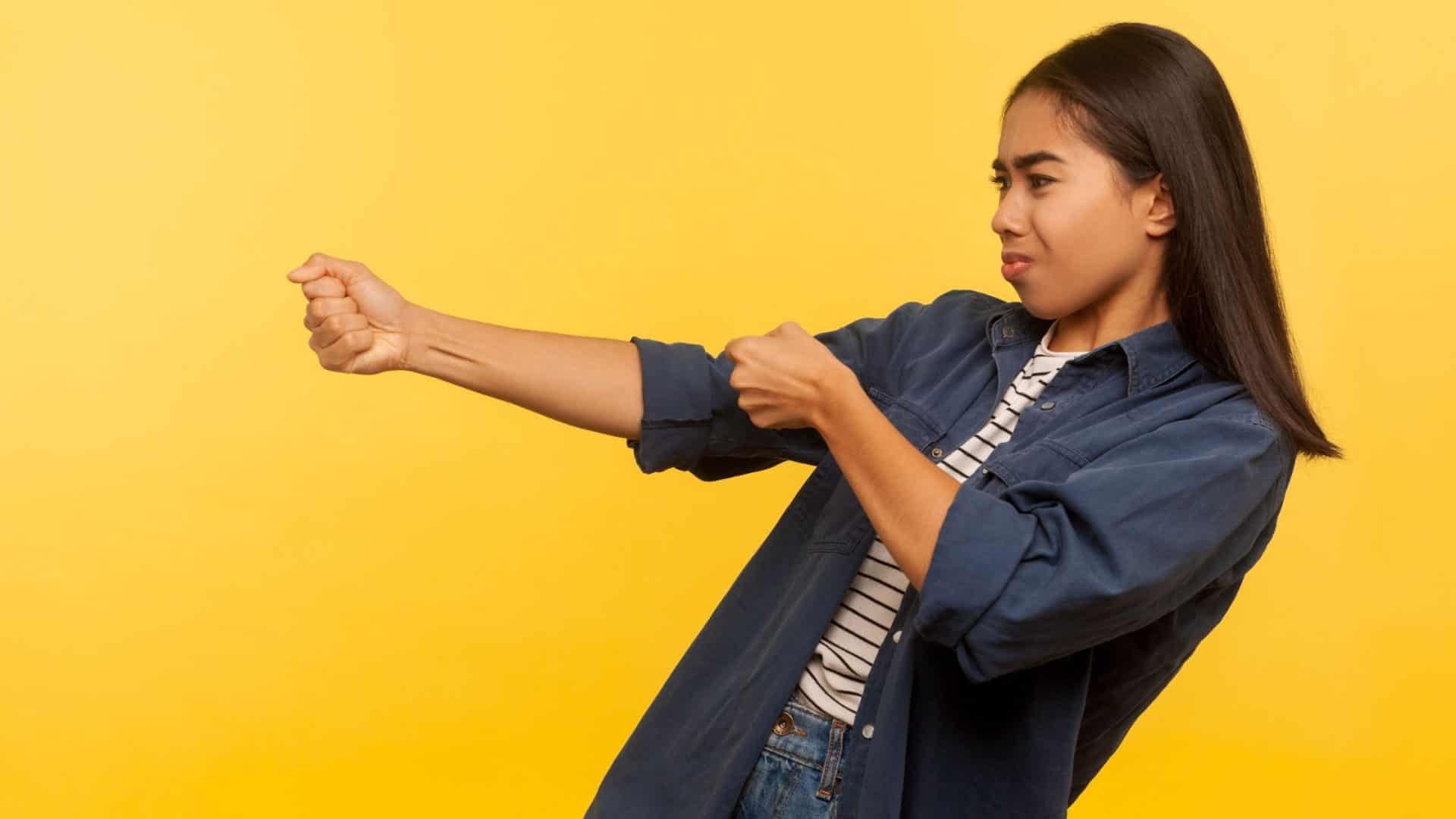 Pull Marketing Strategies for Small Business That Get Customers to Buy Before Prices Go Up 3 pull marketing strategies for small business - woman pulling invisible rope on yellow background