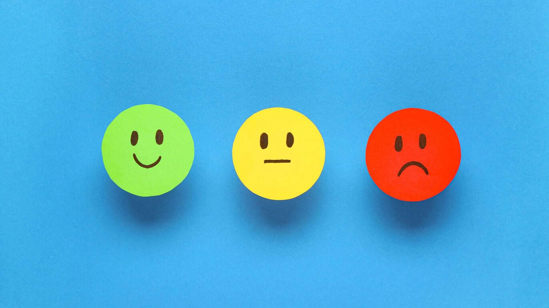 Why Customers Leave Big Companies for Small Business - emoji face ranking on blue background